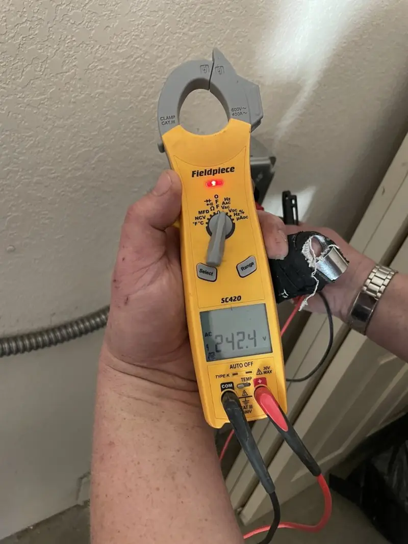 Voltage testing with clamp meter during Ceiling Fan Installation in Argo
